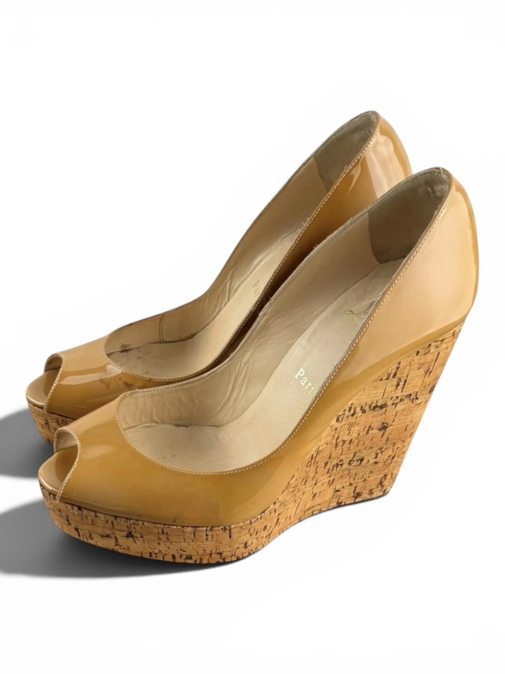 Christian Louboutin patent leather cork wedge pumps.
